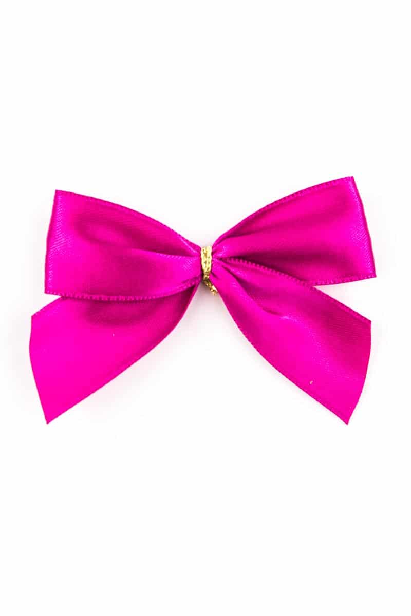 Finished bow made of 25 mm satin ribbon, pink, with clip